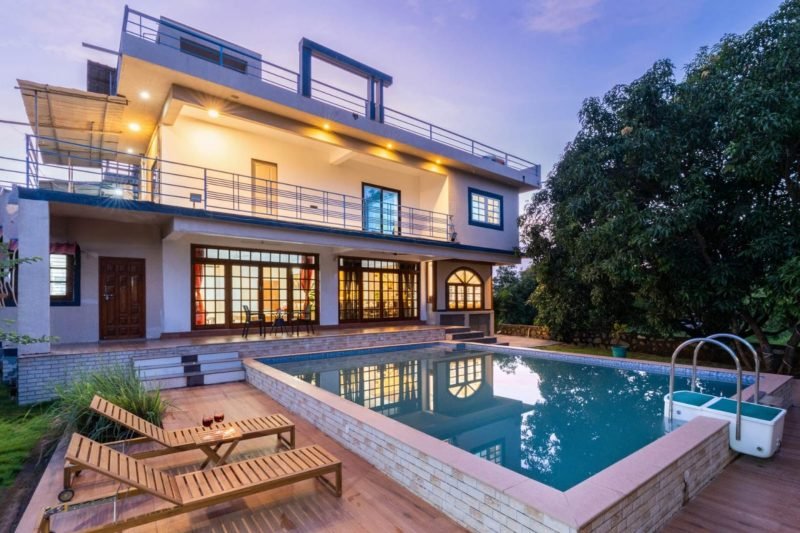 Private pool villa with lawns at dusk